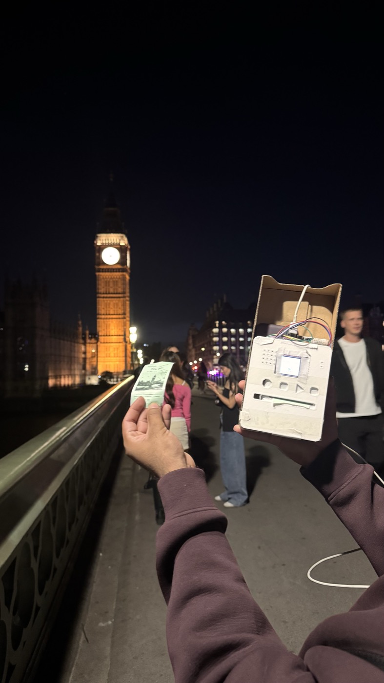 The printed souvenir beside the device that made it.