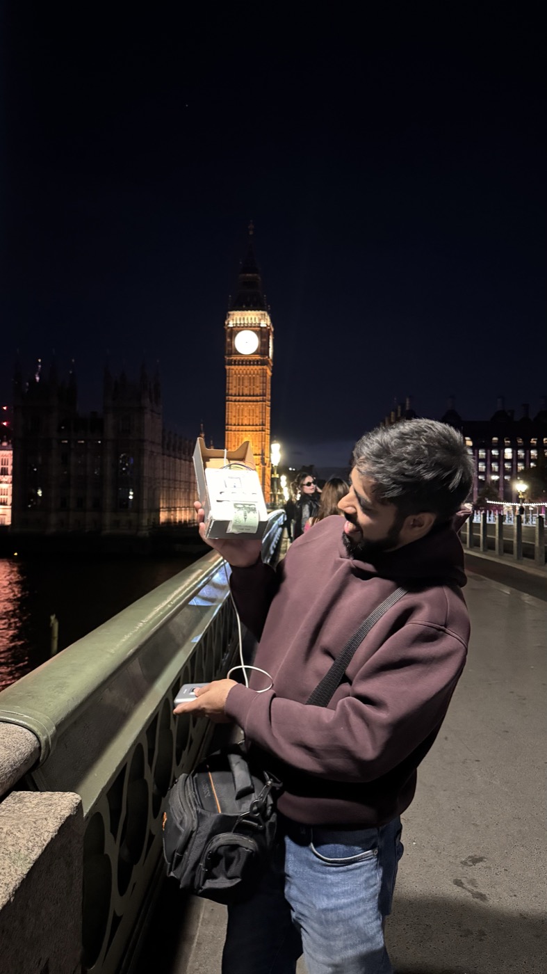 Holding the device up to the night air on Westminster Bridge while it records ten seconds.